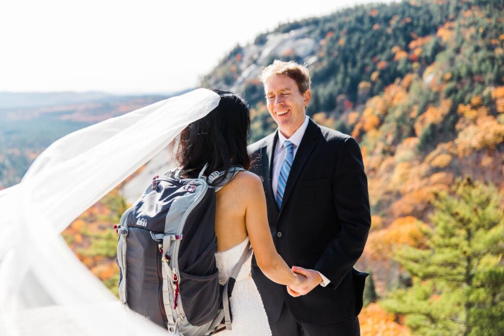 couple standing on mountain new hampshire elopement