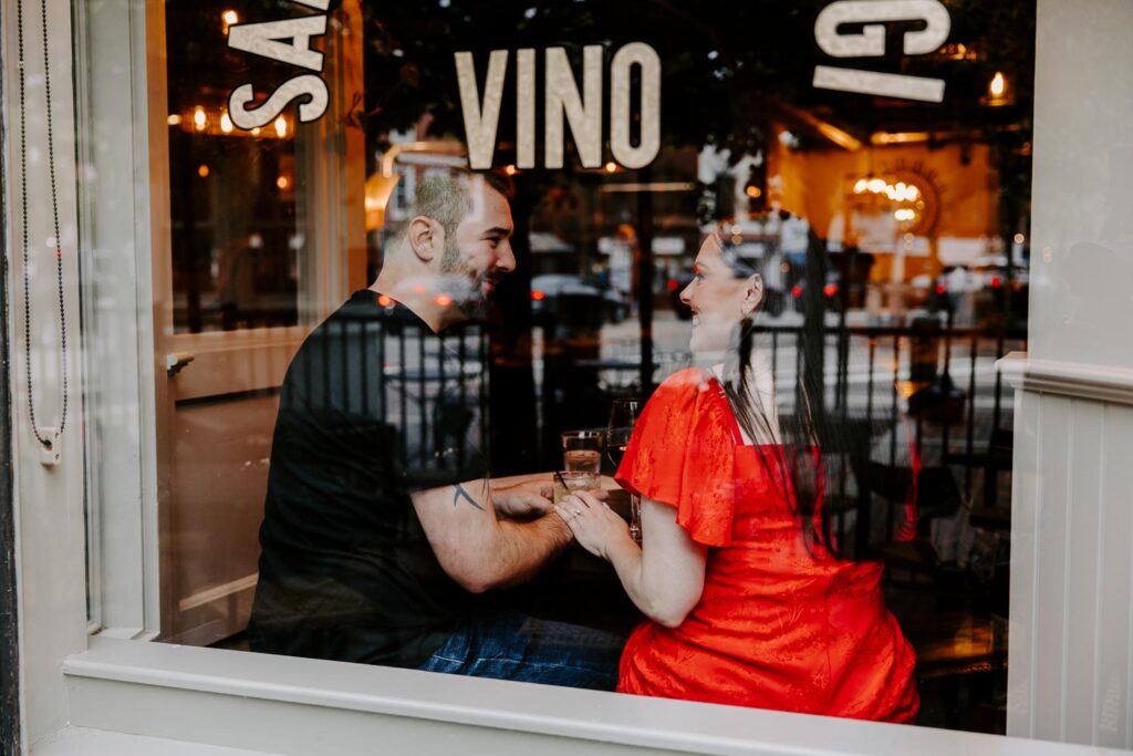 classy couple at a cocktail wine bar what to wear to your engagement session classy red dress