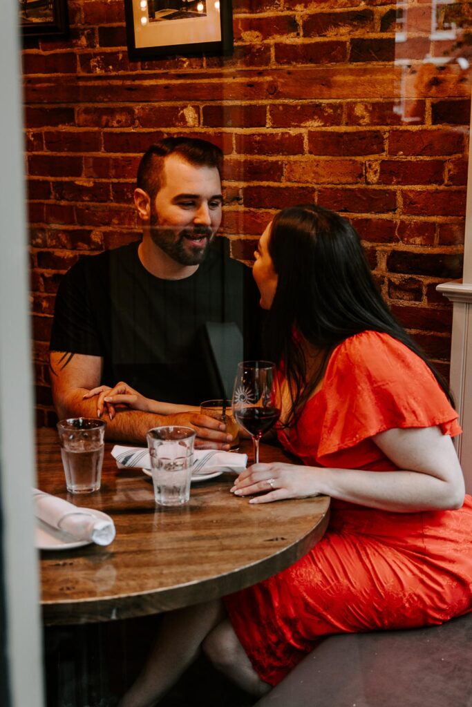 couple kissing wine bar portsmouth nh engagement shoot