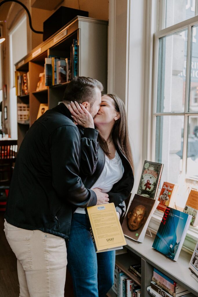couple kissing book store portsmouth nh engagement shoot