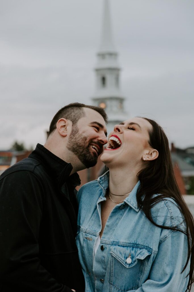 couple laughing rooftop parking garage portsmouth engagement